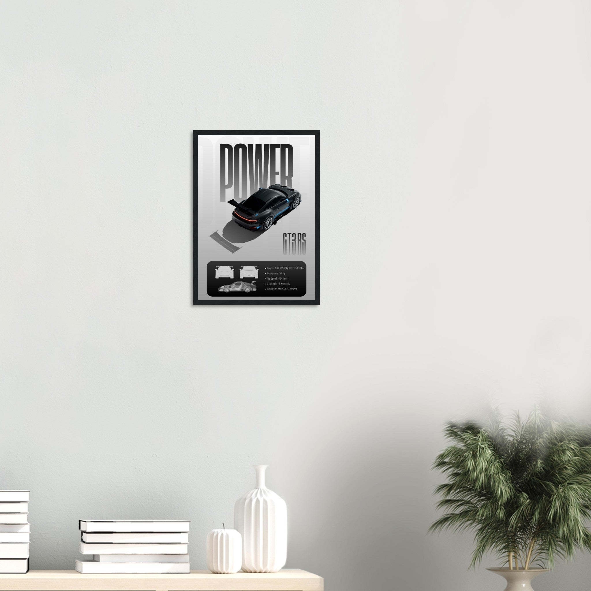 Framed poster with a car design on a wall above a shelf with decorative items.
