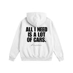 White hoodie with text 'All I Need is a Lot of Cars' on the back against a white background