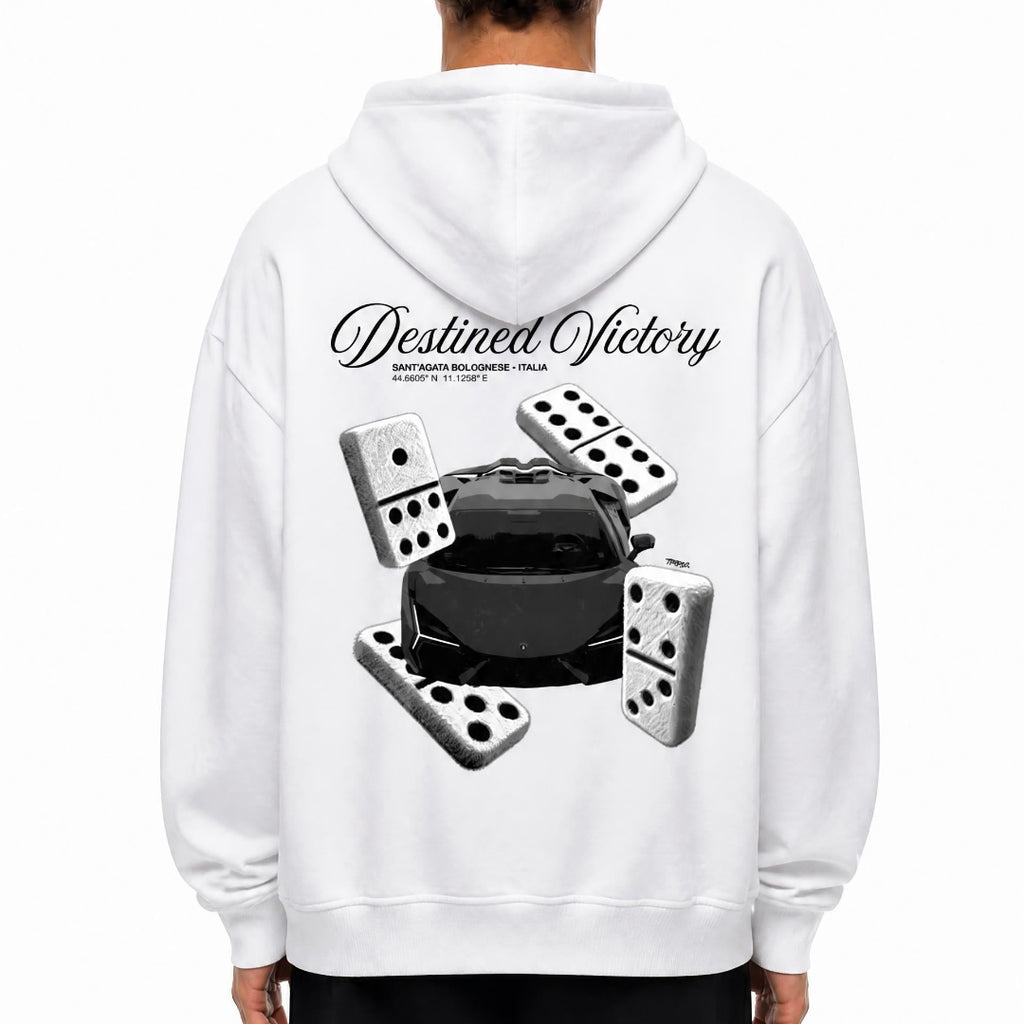A person shown from the back wearing a white hoodie with a large black and gray graphic print on the back featuring the words 'Destined Victory' and several dominoes surrounding a black car. 
