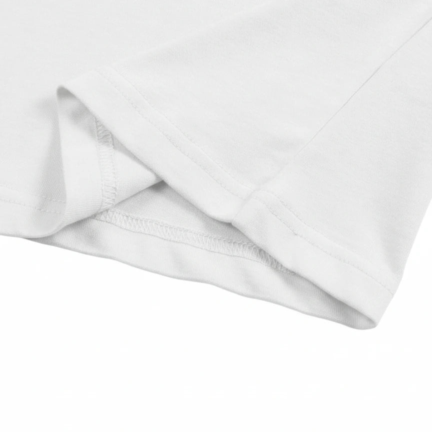 Close-up of a white fabric with a subtle pattern on a white background