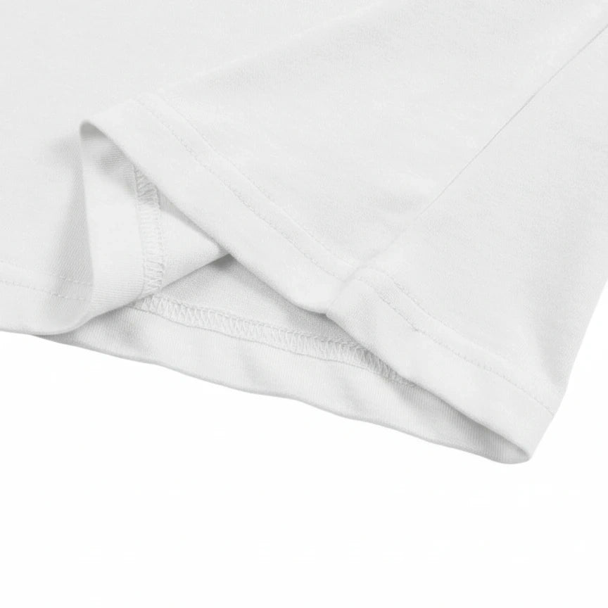 Close-up of a white fabric with a subtle pattern on a white background