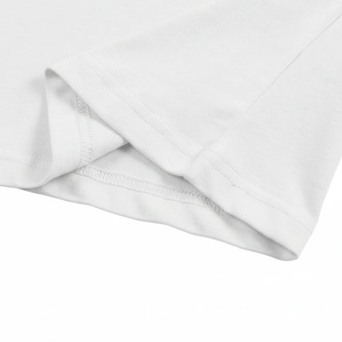 Close-up of a white fabric with a subtle pattern on a white background