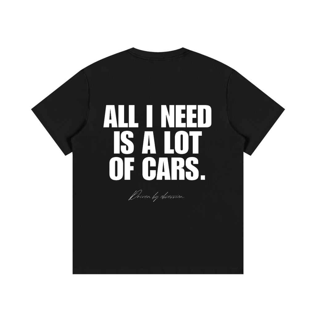 Black heavyweight cotton car enthusiast t-shirt with large white slogan "All I Need Is A Lot Of Cars" – automotive streetwear graphic tee